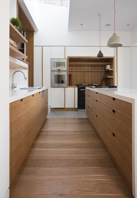 Love the way this floor was laid in such a small space. Makes it seem wider.  Perpendicular Wood Floor, Remodelista Slab Door Kitchen, Contemporary Wooden Kitchen, Wooden Kitchen Cabinets, Contemporary Kitchen Cabinets, Modern Kitchen Cabinet Design, Kitchen Cabinet Pulls, Wood Kitchen Cabinets, Wooden Floors, White Kitchen Design