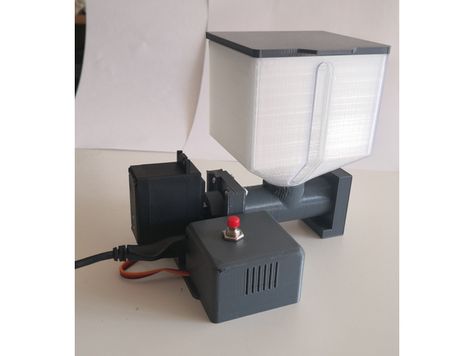 App-controlled programmable automatic fish feeder A remix of "Automatic Fish Feeder" by coberdas The feeder is controlled through an Android app which allows you to program up to 18 feedings per day. For each feeding you can select how much food the feeder dispenses. The amount of food is adjusted by adjusting how long the servo motor runs, this can be set in increments of 0.1 seconds up to a maximum of 25.5 seconds. The amount of food that is dispensed will depend on what servo you us Automatic Fish Feeder, Fish Feeder, Fish Food, Servo Motor, App Control, 5 Seconds, 3d Printing, Fish