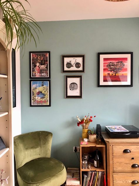 A living room corner, with an green chair and teal blue wall, covered in artwork. Dix Blue Farrow And Ball, Light Teal Walls, Farrow And Ball Dix Blue, Turqoise Bedroom, Delhi House, Colourful Rooms, Farrow And Ball Living Room, Lounge Curtains, Dix Blue