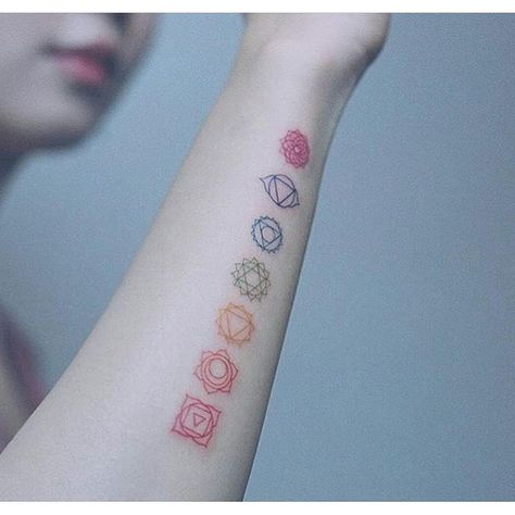 245+ Best Yoga Tattoos Designs and Ideas (2023) - TattoosBoyGirl Chakra Tattoo Forearm, Rainbow Chakra Tattoo, Simple Chakra Tattoo, Small Chakra Tattoos For Women, Chakra Tattoos For Women, Chakra Tattoo Small, 7 Chakras Tattoo Small, Chakra Spine Tattoos For Women, Chakra Symbols Tattoo