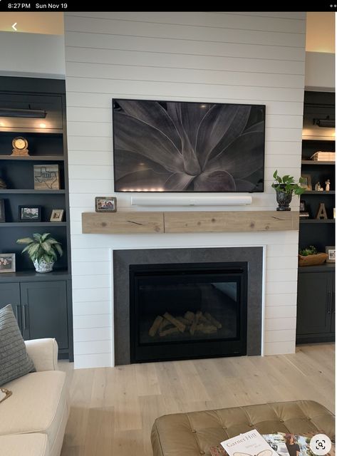 Black Built Ins White Fireplace, Contemporary Farmhouse Fireplace, Accent Wall Beside Fireplace, Flushed Fireplace Wall, Black Built In Fireplace, White Fireplace With Tv Above, Fireplace With Dark Built In Cabinets, Fireplace Paneling Wall Living Room, Wood Accent Fireplace