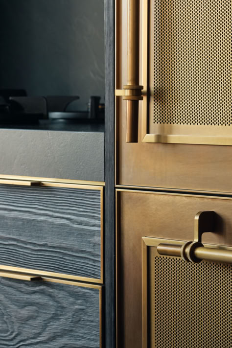 Black textured wood and bronze metal door and drawer details on a kitchen with a black stone countertop and large machined hardware. Wood And Metal Cabinet, Leather Cabinet Doors, Unique Cabinet Doors, Quartz Island, Rolling Ladder, Semi Custom Cabinets, Kitchen Bar Design, Cabinet Trim, Kitchen Ladder