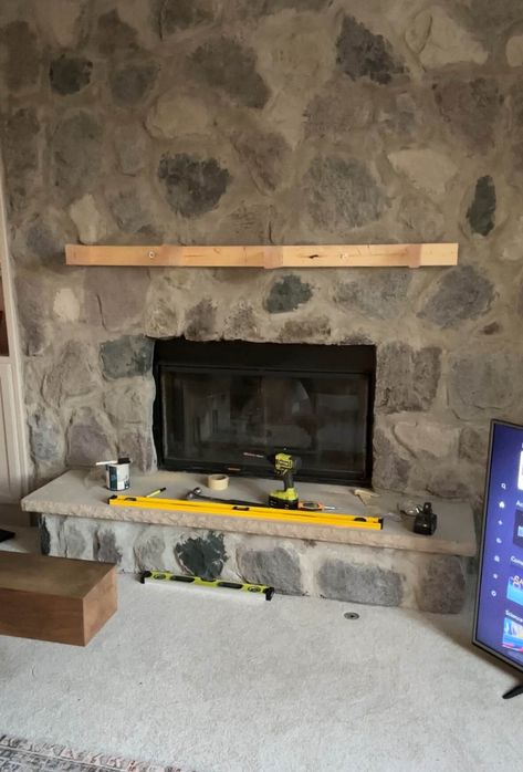 The frame for the mantle mounted above the fireplace. Mounting A Mantle On Brick, Diy Mantle, Diy Fireplace Mantle, Diy Fireplace Mantel, Above The Fireplace, The Mantle, Hide Wires, Rock Fireplaces, Wood Fireplace