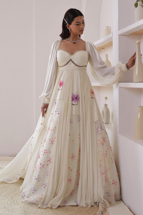 Ivory panelled anarkali with floral print and sequin, bead embroidery. Paired with dupatta. Component: 2 Pattern: Printed, Embroidery Type Of Work: Floral, sequin, bead Neckline: Sweetheart Sleeve Type: Balloon sleeves Fabric: Georgette, Organza Color: Ivory Other Details: Sheer panelled back Occasion: Sangeet - Aza Fashions Maternity Indian Outfits, Anarkali With Dupatta, Haldi Outfits, Printed Embroidery, Lehenga Designs Simple, Anarkali Dress Pattern, Traditional Indian Dress, Fashion Top Outfits, Indian Dresses Traditional