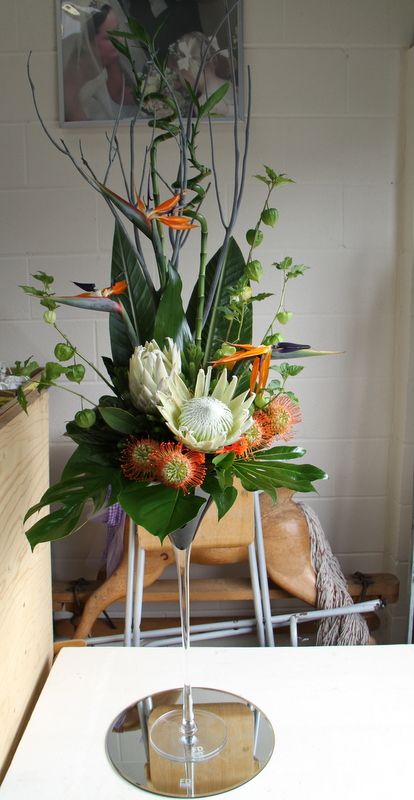 Bird Of Paradise Wedding, Rustic Arrangements, Tropical Flower Arrangements, Paradise Wedding, Altar Arrangement, Orange Wedding Flowers, Birds Of Paradise Flower, Protea Flower, Ocho Rios