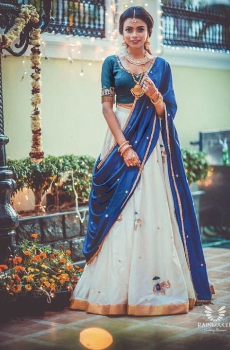 The Most Gorgeous South Indian Lehenga Saree Designs We Spotted! | WedMeGood Blue And White Lehenga, Girls Saree, Blouse Necklace, Unique Saree, White Lehenga Choli, South Indian Wedding Saree, Lehenga Saree Design, White Lehenga, Half Saree Lehenga