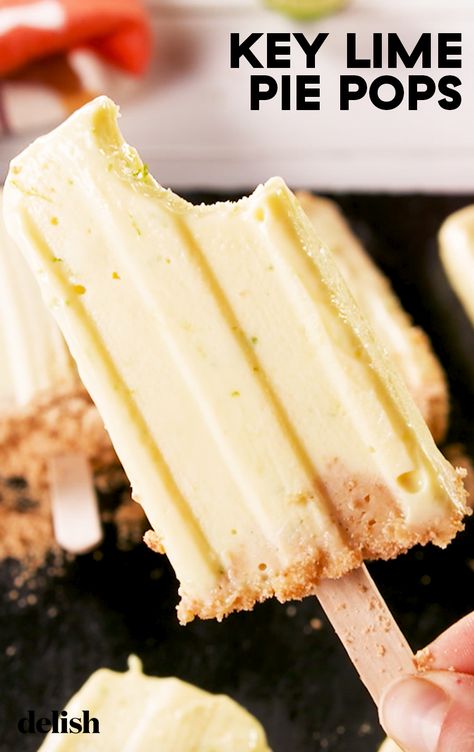 Key Lime Pie Pops are all you need this summer. Get the recipe at Delish.com. #recipe #easy #easyrecipes #delish #dessert #easydessert #keylime #pie #lime #popsicles #summer #nobake #summerrecipes Pie On A Stick, Bites Ideas, Creamy Key Lime Pie, Frozen Key Lime Pie, Lime Popsicles, Simple Snacks, Breastfeeding Snacks, Freezer Recipes, Pie Pops