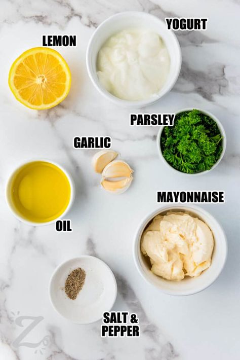 For a versatile go-to dip or dressing that tastes great on salads, bread, and vegetables, try this easy garlic sauce recipe. This Papa Johns copycat is made in just five minutes by blending fresh garlic cloves with mayonnaise, yogurt, lemon juice, olive oil, and herbs. Use it as a dip for pizza crust, but don’t stop there! Rich and tangy garlic sauce tastes amazing on vegetables and sandwiches or as a dip for chips or pretzels. #garlicsauce #garlicsaucerecipe #ourzestylife #garlicsauceforpizza Olive Oil Garlic Sauce, Garlic Sauce For Pizza, Easy Truffles, Lemon Garlic Sauce, Garlic Pizza, Bread Sauce, Garlic Sauce Recipe, Homemade Garlic Bread, Aioli Recipe