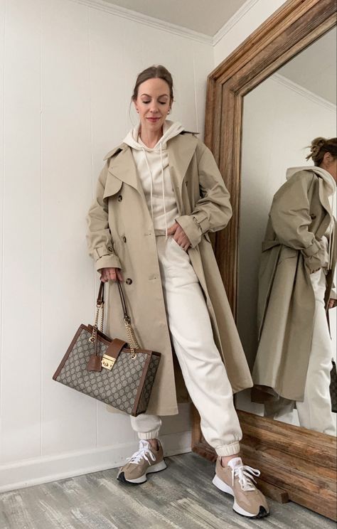 Light brown trench coat styled casually Beige Sweatsuit Outfit, Sweatshirt Trench Coat Outfit, Tracksuit And Coat Outfit, Light Brown Trench Coat Outfit, Light Trench Coat Outfit, Light Brown Coat Outfit, Beige Coat Outfit Classy, Brown Trench Coat Outfit, Beige Coat Outfit