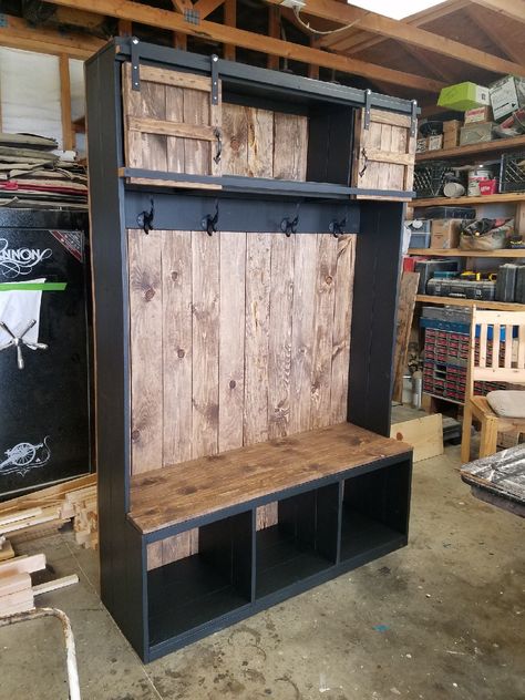 2 toned hall tree with lower cubbies and upper sliding barn doors. Cast iron coat hooks.  Stained in Provincial and Behr Slate. Created by The Trunk Trader - Dewey, AZ Hall Tree Plans, Diy Hall Tree, Door Hall Trees, Hall Tree Bench, Cast Iron Coat Hooks, Lake Ideas, Tree Bench, Farmhouse Style Furniture, Tree Plan