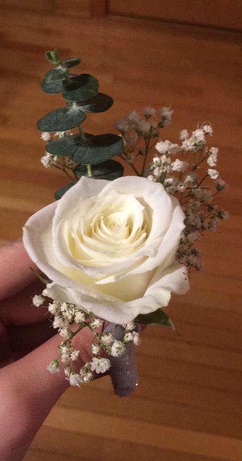 eucalyptus, white rose, and baby’s breath boutonnière White Rose Boutonniere Prom, Simple Rose Corsage, Simple Wedding Bouquet Ideas Diy, White Rose Eucalyptus Babys Breath Bouquet, White Rose Bouquet Prom, Button Holes Wedding Eucalyptus, White Rose And Eucalyptus Boutonniere, White And Eucalyptus Boutonniere, White Rose Corsage And Boutonniere