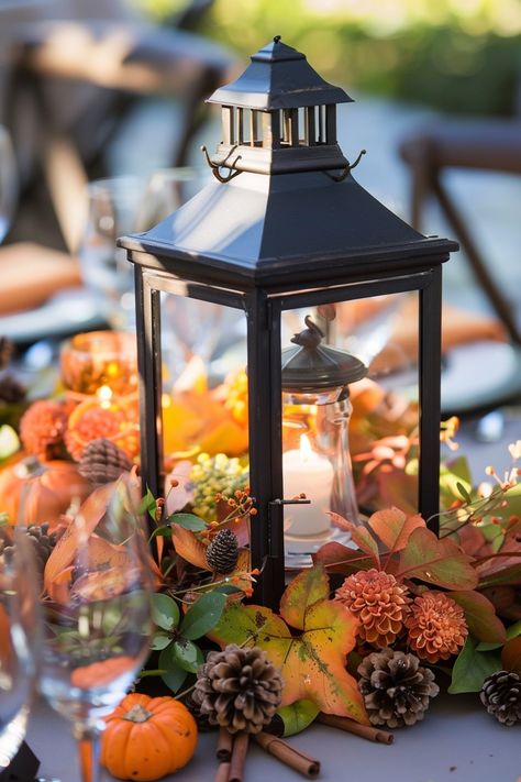 Capture the essence of fall 🍂 with a warm lantern centerpiece for your wedding. Add a romantic touch to your special day with the scent of cinnamon and sweet orange clove decor. Perfect for those seeking a charming autumn vibe! 🕯️🍁 #FallWedding #WeddingInspiration #RusticDecor #AutumnVibes #WeddingIdeas #LanternCenterpiece #CinnamonDecor #OrangeClove September Wedding Centerpieces, Autumn Lantern, 2026 Wedding, Wedding Diys, Lantern Wedding, Lantern Centerpiece, Lantern Centerpiece Wedding, Pumpkin Wedding, Lantern Centerpieces