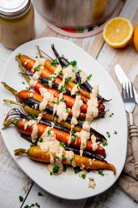 Heirloom Carrots, Roasted Rainbow Carrots, Lemon Tahini Sauce, Rainbow Carrots, Glazed Carrots, Vegan Thanksgiving, Tahini Sauce, Holiday Dining, Thanksgiving Side Dishes