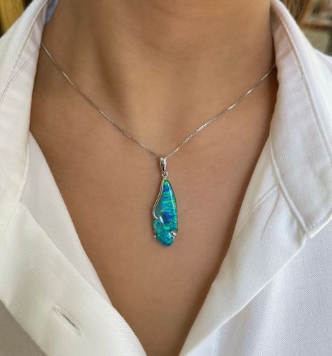 Adorn yourself with the captivating allure of the 'Blue Bay' opal pendant, as charming and expressive as its wearer. This stunning piece showcases a magnificent boulder opal (10.47ct) from Winton, Australia, boasting a mesmerizing play of bright blue-green colors.⁠ ⁠ This pendant captures the essence of the tranquil Australian sea, bringing joy and calmness to its wearer.⁠ ⁠ ⁠ #BlueBayOpal #LimitedEditionLuxury #AnniversaryGifts #ExquisiteElegance #opalminded #jewellerydesigner #jewelrydesign... Boulder Opal Jewelry, Blue Bay, Opal Earrings, Australian Opal, Opal Pendants, Boulder Opal, Opal Jewelry, Bright Blue, Bouldering