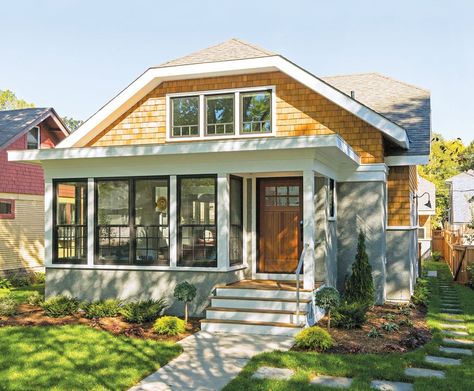 The facade of a bungalow-style home in St. Paul on a sunny day accented by green grass and landscaping. Front Porch Bungalow, White Bungalow Exterior, Bungalow Aesthetic, Michigan Bungalow, 1926 Craftsman Bungalow, Portland Bungalow Exterior, Traditional Bungalow, California Craftsman Bungalow, 1920s Craftsman One And A Half Story Bungalows