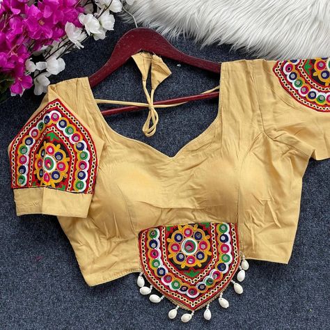 Price__550 free shipping *TRADITIONAL NAVRATRI SPL. HALTER NECK BLOUSE* *Fancy Design With Kaudi Lace* *Heavy Embroidery+Hand Mirror Work Blouse* *FABRIC*:--Heavy Magic Cotton *SIZE*:-* Size 38” Ready ulter upto 42 Inch.* *SLEEVES*:- * elbow *DESGINE*:- Beautiful Traditional Blouse Heavy Stitching Heavy Padded With Beautiful Mirror Work BACK open Style #blouse #blousecantik #blousemurah #designerblouse #blousewanita #trending #blouses #blousedesign #blouselove #blouseideas ... Halter Neck Blouse, Halter Neck Blouses, Mirror Work Blouse, Beautiful Mirror, Fancy Design, Embroidery Hand, Heavy Embroidery, Beautiful Mirrors, Style Blouse