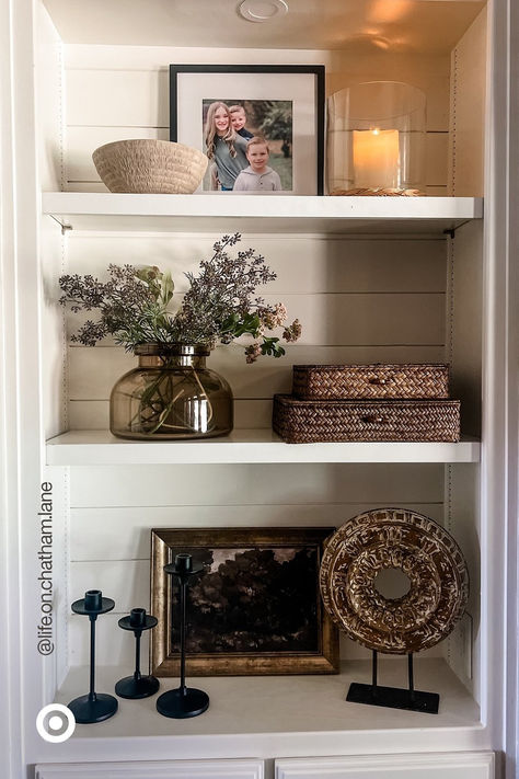 Spruce up your space with a modern-rustic vibe you’ll love for seasons to come. Mix & match textured decor accents. Add a glass vase with faux flowers to make your space extra cozy. P.S. Add these to your entryway, bookshelf or your dresser to liven up any corner. Decor On Top Of Bookcase, Built In Shelf Decor, Cabinet Styling, Apartment Finds, Built In Shelves Living Room, Shelf Decor Living Room, Styling Shelves, Room Vibes, Decorating Bookshelves