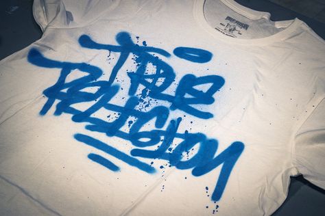 We spray painted T-shirts live at a True Religion store event using indoor safe water based spray paint. We specialize in customization with spray paint and airbrush.  We provide graffiti artists for live events throughout the country.  Visit our website to see more examples of customization projects or call us at 646-801-6024. Spray Painted Tshirt, Spray Painted Jeans, Spray Paint T Shirt, Spray Painted Shirt, Spray Painted Clothes, Spray Paint Jeans, Spray Paint Shirt, Purple Spray Paint, Custom Tee Shirt