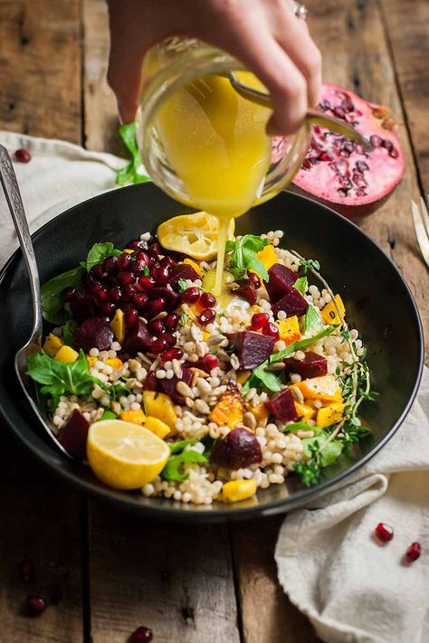 Do you love the taste of root veggies? If so, this butternut and beet salad with couscous and pomegranate seeds should be in your recipe book! Healthy greens, citrus fruit, and squash pack vitamins into a simple recipe dish that’s chalk full of flavor. Find it now on Foodal. #butternut #beets #pomegranate #foodal Best Butternut Squash Recipe, Beet Salad Recipe, Couscous Salad Recipes, Beet Salad Recipes, Winter Dishes, Couscous Recipes, Root Veggies, Butternut Squash Recipes, Couscous Salad