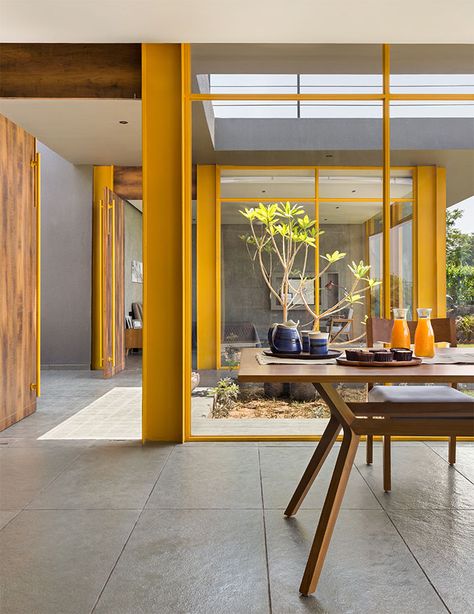 Take a tour of The Yellow Box, a serene holiday home by Workshop Inc that seamlessly blends nature with architecture | ELLE Decor India Interior Design Guidelines, Kota Stone Flooring, Weekend Home, Reconnect With Nature, Stone Interior, Architects Office, Natural Stone Flooring, Design Guidelines, Glass Facades