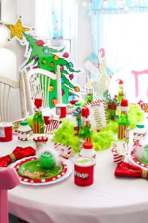 Don't miss this fun Grinch Christmas party! The table settings are awesome! See more party ideas and share yours at CatchMyParty.com #catchmyparty #partyideas #christmas #christmasparty #thegrinch #grinchparty Grinch Table Decorations Christmas Centerpieces, The Grinch Table Setting, Grinch Kids Table, Grinch Tea Party, Grinch Theme Table, Grinch Party Table, Grinch Party Table Decorations, Grinch Breakfast Party, The Grinch Party Decorations