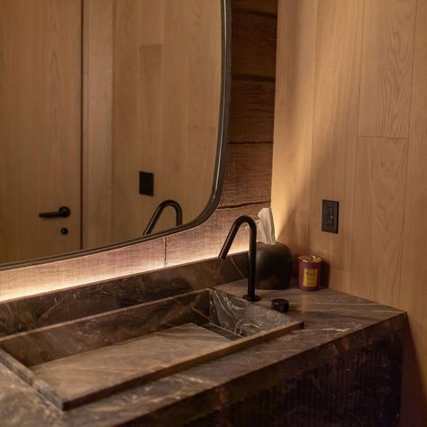 Powder Room Lighting Inspo:  Moody cove lighting and natural wood tag-teaming it to create a warm, luxe and comfortable atmosphere. ⁠ ⁠ Build: @shorlineconstruction⁠ Project: #shorlineriverdale⁠ Architectural Design: @foreshew_da⁠ Interior Design: @chapichapodesign⁠ Electrical: @mcmorranelectric⁠ Architectural Lighting Supply: @darktoolsto⁠ HVAC: @duffmechanical⁠ Exterior Cladding Supply: @muskokalumber⁠ Insulation: @bask.pro.inc⁠ Photography: @stephaniememoryphotography Shower Cove Lighting, Shower Cove, Limestone Sink, Powder Room Lighting, Cove Lighting, Indirect Lighting, Architectural Lighting, Wood Tags, Downstairs Bathroom