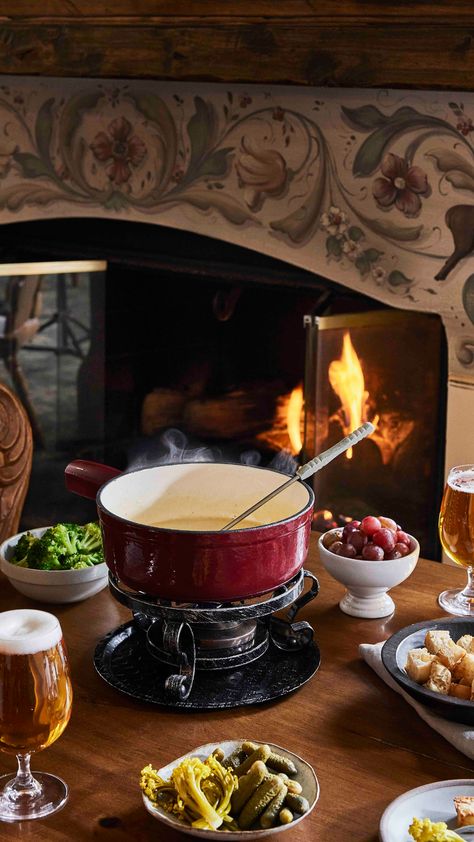 Tuck into a cozy fireside meal of savory fondue and hearty alpine cuisine at the Bavarian-inspired mountainside retreat, Goldener Hirsch, in Utah. #AlwaysAuberge Savory Fondue, Mountainside Retreat, Cozy Fall Dinner, Sunnies Cafe, Bavarian Pretzel, Ski Wedding, Fluffy Waffles, Antique Dining Chairs, Charcuterie Plate