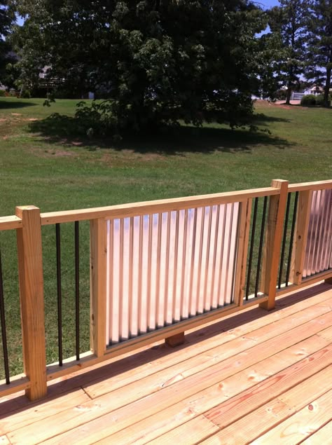 My new railings.  Corrugated Metal and metal balusters.  My husband is a genius! Corrugated Metal Deck Railing, Fence Decorating Ideas, Cedar Fence Ideas, Corrugated Metal Fence, Metal Balusters, Diy Backyard Fence, Door Decks, Deck Railing Ideas, Landscape Timbers