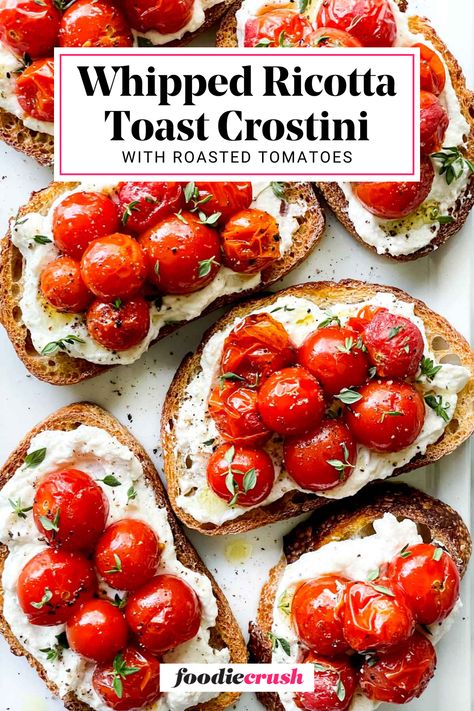 This Whipped Ricotta Toast Crostini with Roasted Tomatoes recipe is the perfect appetizer for any occasion!  Creamy ricotta cheese is seasoned and whipped, then spread on toasted slices of bread.  Tangy, oven-roasted tomatoes add a pop of flavor and color, making this a simple yet impressive dish that's ready in under 30 minutes. Whipped Ricotta With Roasted Tomatoes, Whipped Ricotta And Roasted Tomatoes, Roasted Tomato Toast, Roasted Strawberry Whipped Ricotta Toast, Toast With Ricotta Cheese, Whipped Ricotta Bruschetta, Spread Recipes For Bread, Toasted Bread Recipes, Whipped Ricotta Crostini