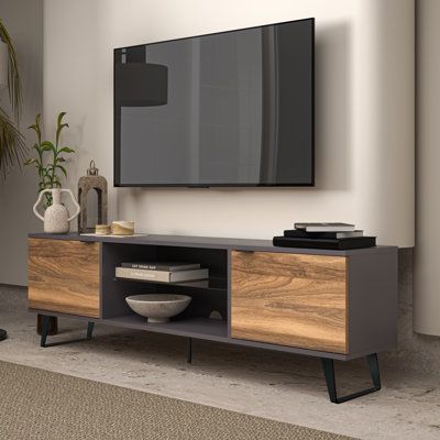 Upgrade your living room with the sophisticated, contemporary, and mid-century modern Kapamilya TV Stand. This sleek and modern stand is available in your choice of oak, walnut, and mixed-color finishes, allowing you to customize it to your style. With its unique design and high-quality construction, the Kapamilya TV Stand is sure to become the centerpiece of your entertainment area. Measuring 71 inches in width, 21 inches in height, and 14 inches in depth, the Kapamilya TV Stand is the perfect Modern Living Room Colors, Tv Console Modern, Mid Century Modern Tv Stand, Modern Tv Units, Living Room Tv Stand, Tv Unit Design, Entertainment Centers, Modern Tv Stand, Tv Stands And Entertainment Centers