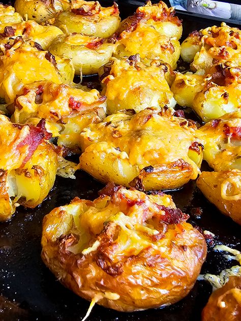 This cheesy smashed potatoes recipe is an irresistible oven roast of melted cheese and crispy bacon over tender crunchy baby potatoes! Smash Roasted Potatoes, Crispy Cheese Potatoes, Cheesy Smashed Red Potatoes, Cheesy Smashed Baby Potatoes, Smashed Small Potatoes, Cheesy Smashed Potatoes, Smashed Baby Potatoes, Smashed Potatoes Baked, Crunchy Baby