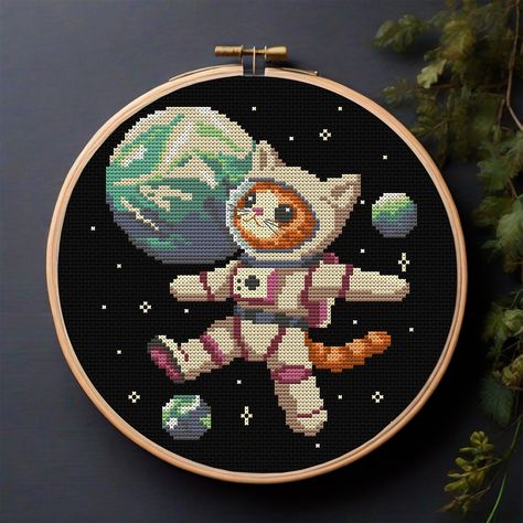 Astronaut Cat, bravely exploring new planets beyond our galaxy. With his trusty space suit and boundless curiosity, he ventures into the unknown, discovering worlds never before seen by feline or human eyes. 🚀🌌 . . . Available in my Etsy store (link in bio) #AstronautCat #tourmalinepattern #crossstitch #crossstitchpattern #cosmos #space #galaxy #galaxycat #cat #spaceart #planets #stars #kitty #xstitch #xstitchpattern #catcrossstitch #catxstitch #funnycat #astronaut #spacesuit #xstitchlove #em... Cross Stitch Patterns Galaxy, Space Embroidery Pattern, Cute Cat Cross Stitch, Space Embroidery, Funny Astronaut, Space Pattern, Galaxy Cat, Funny Cross Stitch Patterns, Pattern Cat