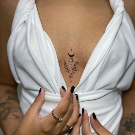 https://bit.ly/3JLxv52 Moon Chest Tattoos For Women, Rose Tattoo Chest Woman, Minimalist Chest Tattoo Female, Tattoo Between Breast Women, Girls Chest Tattoos, Acc Revision, Rose Chest Tattoos Female, Between The Breast Tattoo, Moon Chest Tattoo Female