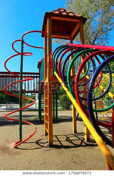 Colorful Metal Playground Yard Stock Photo (Edit Now) 1756879373 Metal Playground, Cabin Vibes, Backyard Playground, Kids Playground, Experience Design, Garden Arch, Photo Editing, Photo Image, Every Day