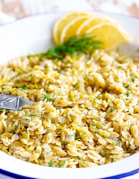 This Greek Orzo with Lemon and Herbs makes the best side dish for fish or chicken. It is quick to cook and packed with flavor. In under 15 minutes, you can have this fresh and delicious pasta side dish ready for the table. I find that kids love the little pasta too! You can serve it hot or cold and it tastes wonderful the next day, making it great for lunchboxes. #greekfood #easysidedish #quickpasta #pastasidedish Greek Lemon Orzo, Greek Orzo, Greek Side Dishes, Greek Lemon Chicken, Lemon Orzo, Orzo Recipe, Side Dishes For Fish, Vegetarian Pasta Recipes, Orzo Recipes