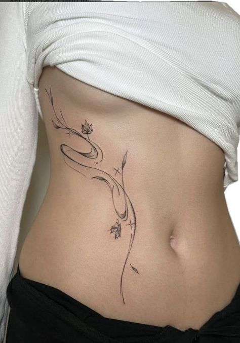 Korean Fine Line Tattoo, Vietnamese Tattoos For Women, Whispy Tattoo, Whispy Tattoos, Side Of Body Tattoos For Women, Stomach Tattoos Ideas, Flower Tattoo Stomach, Lower Spine Tattoos For Women, Flower Stomach Tattoos