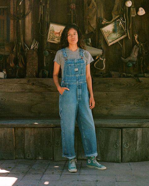 Our Unisex fit in a Vintage Washed Denim. These are a looser and roomier fit which are based off of our favorite vintage pair of overalls! These include lots of little details including green accent stitching, a carpenter loop + pocket, and triple needle stitch seams. They are designed to fit oversized. You can size down for a more fitted look if preferred. 00 / XXS (jean size 24-25) | 0 / XS (jean size 26-27) | 1 / S (Jean size 28-29) | 2 / M (jean size 30-31) | 3 / L (Jeans 31-32) | 4 / XL (jeans 33-34) | 5/ XXL (jeans 36-38) Lauren is 5'5", size 25-26 jean wearing the 1 for an oversized look Oversized Overalls Outfit, Overalls Outfit 90s, Maximalist Wardrobe, All Star Outfits, Oversized Overalls, Lifestyle Posing, Oversize Outfit, Overalls Vintage, Overalls Fashion