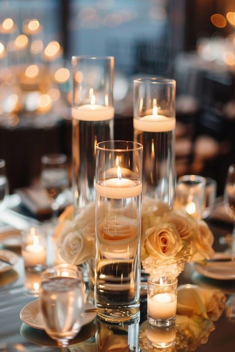 Transform your big day with the simplest touch of elegance 🕯️👰💍. Discover the magic of soft, ambient lighting that brings serene vibes to your wedding reception. #WeddingDecor #WeddingCenterpiece #ElegantWedding #RomanticDecor #CandleDecor #WeddingInspiration #BrideToBe #WeddingPlanning Light up your love story! Minimal Centerpieces, Beige Candles Wedding, White Candle Lit Wedding, Led Flameless Candles Wedding, Candle Only Reception, Candle Lit Reception Romantic, Elegant Wedding Table, Floating Candles Wedding, Floating Candle Centerpieces