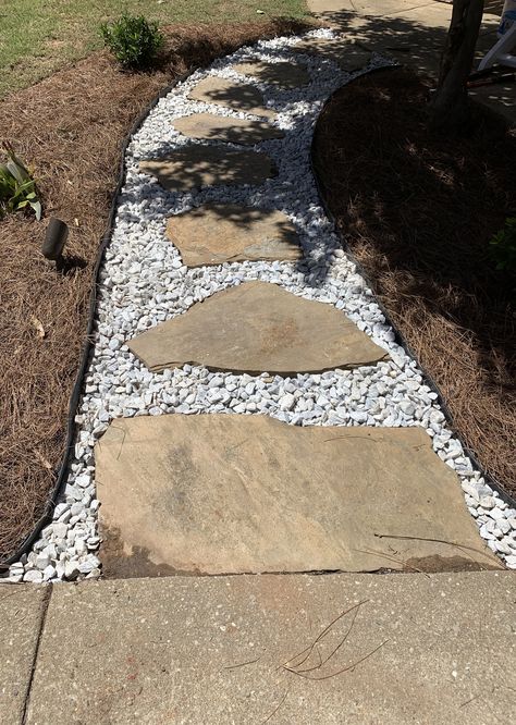 Dig out the dirt around the rock about 1-1.5”.  Then lay down marble chip rock. Tamper into place. White Marble Chips Landscaping, Marble Chips Landscaping, Slate Rock, Landscape Rock, Creek Bed, Backyard Inspo, Outdoor Ideas, Patio Ideas, Backyard Decor