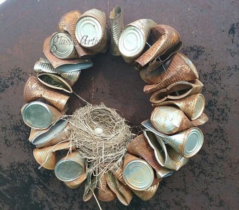 This rusty, country style wreath may not be everyone’s cup of tea, but it looks right at home in my rural garden, so I’m sharing it just for fun! While going through old garden magazines last year, I caught just a glimpse of the side of a tin can wreath hanging in the picture of a garden, so of course I felt the need to make one. I threw a bunch of dog food cans in a tub of water to soak outside for a few weeks and start the rusting process. After dumping the cans to dry, I creased th… Can Wreath, Recycled Tin Cans, Fall Decor Diy Crafts, Dollar Store Hacks, Recycled Tin, Diy Fall Wreath, Pallet Crafts, Love Fall, Simple Valentine