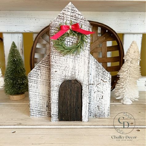 "Decorate your home or give as a gift to your family and friends who love to decorate their home with rustic, primitive beautiful Christmas decor.  This \"Christmas Church\" is made of reclaimed barn wood with beautiful weathering, and saw marks. White chalk paint is dry brushed over the natural barn wood texture. Water based stain is used for the door feature and the roof top. The piece is then sealed with a water based sealer. The Christmas wreath is securely attached with staples. Measures 12 inches tall, 9 inches wide and 2 inches thick. Free Shipping. Check out the EASTER CHURCH listing here. https://www.etsy.com/ChalkyDecor/listing/1373290112/he-is-risen-white-church-with-cross?utm_source=Copy&utm_medium=ListingManager&utm_campaign=Share&utm_term=so.lmsm&share_time=1673041096344   Le Scrap Wood Crafts, Cozy Christmas Decor, Christmas Houses, Barn Wood Crafts, Christmas Church, Church Crafts, Water Based Stain, Christmas Wood Crafts, Primitive Christmas