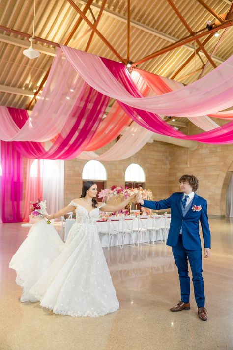 Bright Pink Wedding with vibrant drapery. Bride and Groom dancing in their reception space Pink And Orange Wedding Reception, Pink And Orange Wedding Theme Decor, Hot Pink And Gold Wedding, Wedding Reception Ceiling, Hot Pink Wedding Colors, Barker Wedding, Chocolate Table, Bright Pink Wedding, Wedding Gown Lace