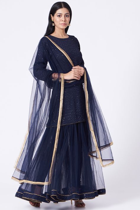 Featuring a navy blue kurta in georgette base with sequins embroidery. It is paired with a matching sharara and a net dupatta.  FIT: Fitted at bust and waist. COMPOSITION: Georgette, Net. CARE: Dry clean only. Midnight Blue Gown, Navy Blue Kurta, Royal Blue Colour, Embroidered Sharara, Blue Kurta, Sharara Set, Net Dupatta, Indian Fashion Designers, Royal Blue Color