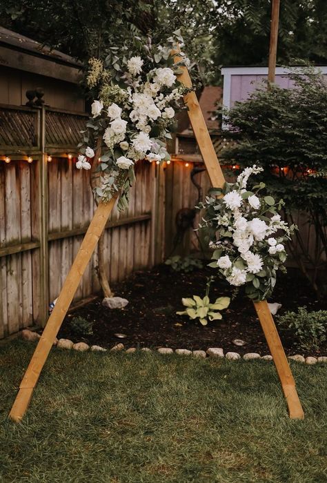 A Wild & Asymmetrical Floral Triangle Wedding Arch Installation for an Intimate Outdoor Backyard Wedding. Created using a Garden Style Filled With Fresh Greenery and Soft White Florals Wedding Arch No Flowers, Arch Installation, Wedding Arch Greenery, Outdoor Backyard Wedding, Floral Wedding Arch, Wedding Arches Outdoors, White Wedding Theme, Wedding Arch Flowers, Private Wedding