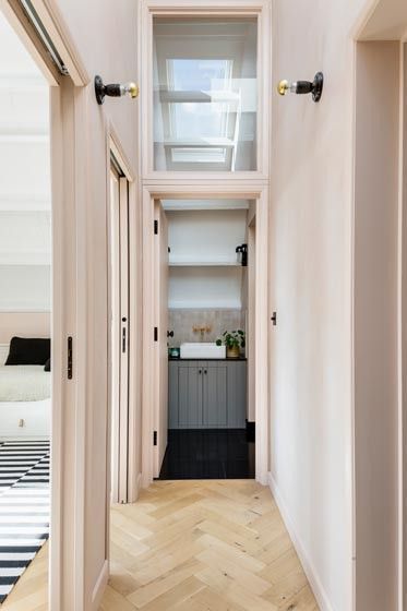 Herringbone wood floors in a blonde shade + light blush pink walls + millenial pink + sconces in the hallway | Imperfect Interiors Pink Hallway, Setting Plaster, Pink Paint Colors, Old House Interior, Vintage Industrial Lighting, Natural Wood Flooring, Pink Paint, Plaster Walls, Painted Ceiling