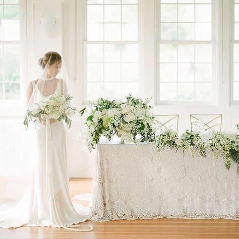 Okay...WHOA! How stunning is this floral table decor draped in a luscious array of classic white blooms and tropical greenery? Our editorial shoot on the Big Island of Hawaii enhanced all the luxuriously chic details of our Modern Elegance Collection into a truly phenomenal design ⠀⠀⠀⠀⠀⠀⠀⠀⠀ || Modern Elegance Collection, Big Island, Hawaii || ⠀⠀⠀⠀ Newlywed Table, Flowers Arrangements Wedding, Bridesmaid Color Scheme, Bride Groom Table, Sweetheart Table Decor, Wedding Reception Dinner, Head Tables, Main Table, Wedding Reception Design