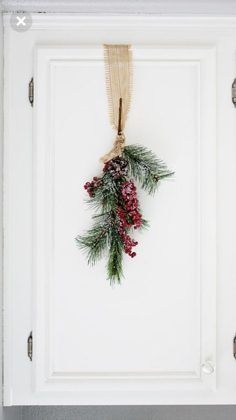 Christmas Over Cabinet Decor, Apartment Christmas Door Decor, Cabinet Door Christmas Decorations, Christmas Decor On Cabinets, Ribbon On Cabinets For Christmas, Christmas Cabinets, Christmas Cupboard Decorations, Kitchen Cabinets Christmas Decorations, Diy Cabinet Wreath