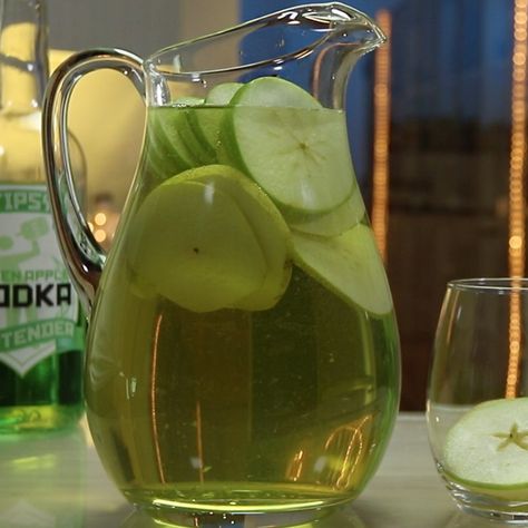 Bust out with this Green Apple Sangria at your next party and everybody will love you — or at least they'll love the sangria. This awesome wine cocktail combines apple vodka, Sour Apple Pucker, wine, white grape juice, apples, and pears, and tastes like a little green dream. Jolly Rancher Cocktail, Green Apple Sangria, Green Apple Jolly Rancher, Vodka Sangria, Green Apple Vodka, Sour Apple Pucker, Cooking Goals, White Grape Juice, Sangria Drink