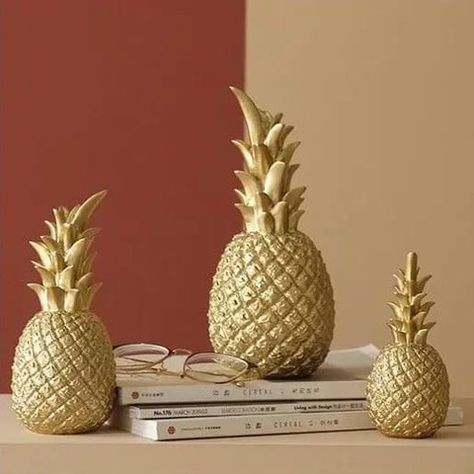 @selidavStore posted to Instagram: Exquisite and made of High Quality Resin This beautiful Pineapple decorative ornament is made out of High Quality Resin, making it light weight and environmentally friendly. #resinart #resinpineapple #resincraft #resinhomedecor #resin #pineappledecor #shelfdecor #tabletopdecor Pineapple Crafts, Pineapple Ornament, Fruit Sculptures, Golden Pineapple, Living Room Ornaments, Pineapple Decor, Artificial Fruit, Pineapple Fruit, Gold Pineapple