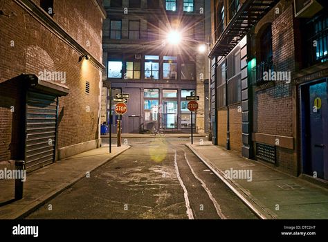 Download this stock image: Deserted dangerous empty alleyway in urban industrial scene. - DTC2H7 from Alamy's library of millions of high resolution stock photos, illustrations and vectors. New York Alleyway, Dark Street, Urban Industrial, City Street, Fashion Lighting, Empath, City Streets, Short Film, Mood Board